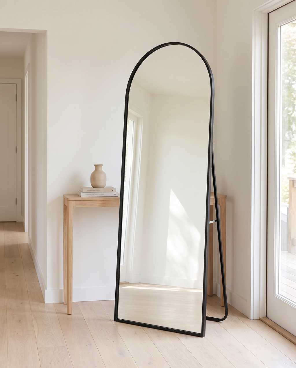 Arched Metal Full-Length Mirror, black stand, standing in bright entryway