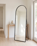 Arched Metal Full-Length Mirror, black stand, standing in bright entryway