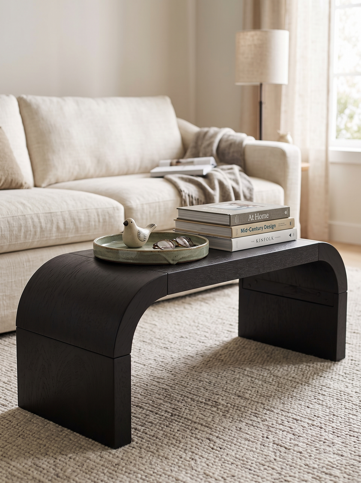 Melanija Curved Coffee Table styled with books and tray