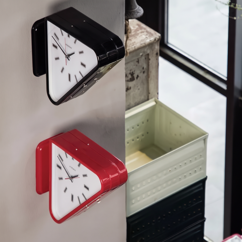 Nova Triangle Double-Sided Corner Wall Clock, black and red color variants on wall