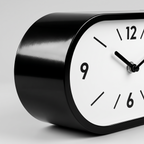 Kellan Black Curved Double-Sided Corner Wall Clock close up of casing and dial