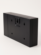 Back of Harlan clock showing the wall mounting bracket and screw holes