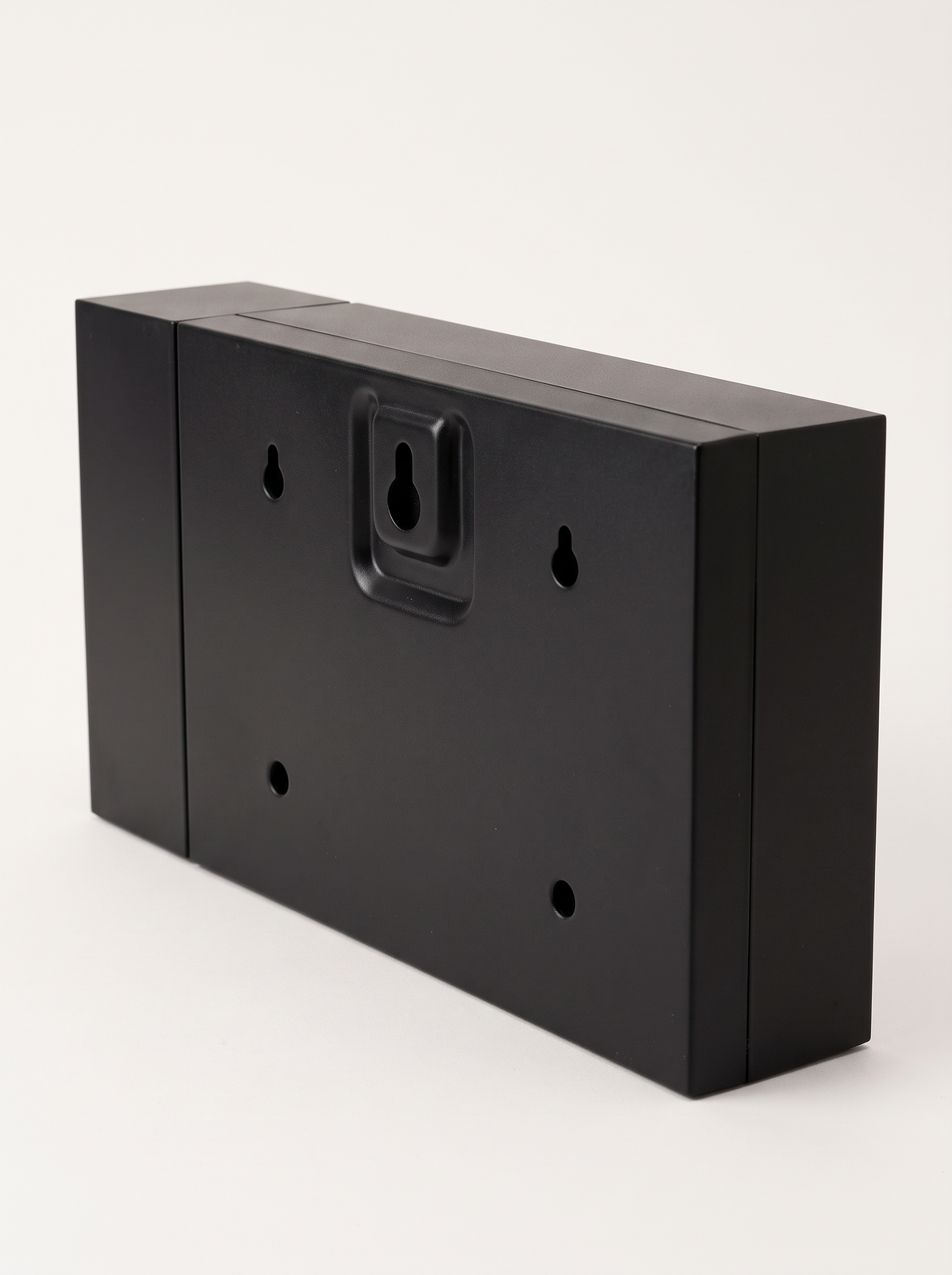 Back of Harlan clock showing the wall mounting bracket and screw holes